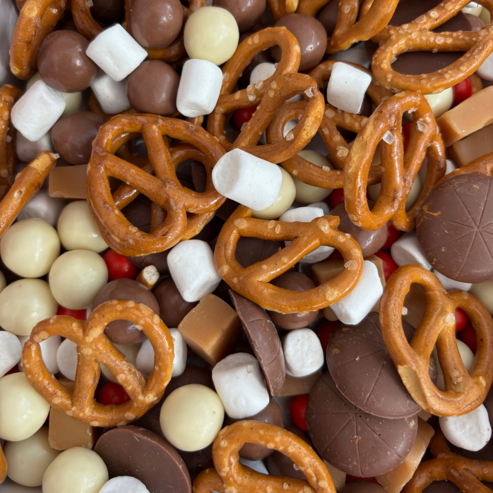Chocolate gift box filled with chocolate pizza buttons, pretzels, vanilla fudge and more.